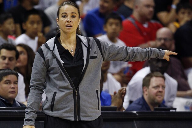 Becky Hammon coaches the San Antonio Spurs during the first half of an NBA summer league basketball game against the Boston Celtics, Saturday, July 18, 2015, in Las Vegas. (AP Photo/John Locher)