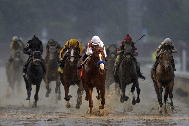 Mike Smith rides Justify to victory during the 144th running of the Kentucky Derby horse race at Churchill Downs Saturday, May 5, 2018, in Louisville, Ky. (AP Photo/Darron Cummings)
