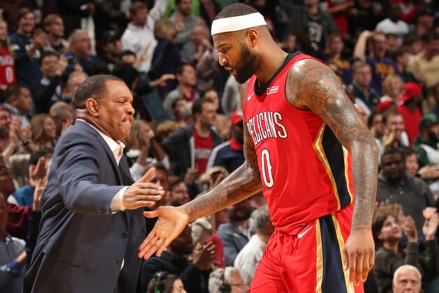 OKLAHOMA CITY, OK - DECEMBER 13:  DeMarcus Cousins #0 and Alvin Gentry of the New Orleans Pelicans shake hands during the game against the Milwaukee Bucks on December 13, 2017 at Smoothie King Center in New Orleans, Louisiana. NOTE TO USER: User expressly acknowledges and agrees that, by downloading and or using this photograph, User is consenting to the terms and conditions of the Getty Images License Agreement. Mandatory Copyright Notice: Copyright 2017 NBAE (Photo by Layne Murdoch/NBAE via Getty Images)