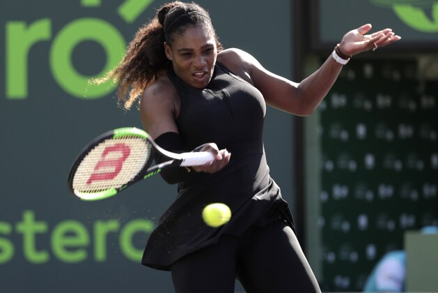 Serena Williams returns to Naomi Osaka of Japan, during the Miami Open tennis tournament, Wednesday, March 21, 2018, in Key Biscayne, Fla. (AP Photo/Lynne Sladky)