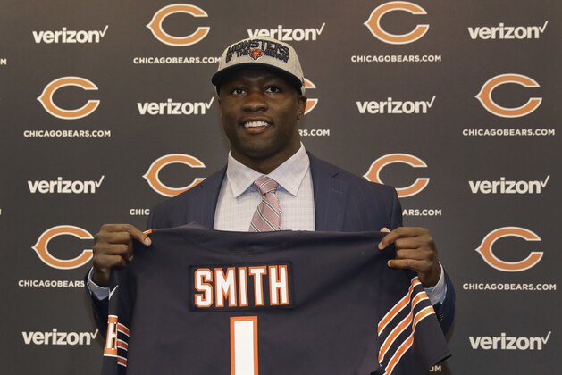 Chicago Bears first round draft pick, University of Georgia linebacker Roquan Smith, poses with a jersey during an introductory NFL football news conference Friday, April 27, 2018, in Lake Forest , Ill. (AP Photo/Charles Rex Arbogast)
