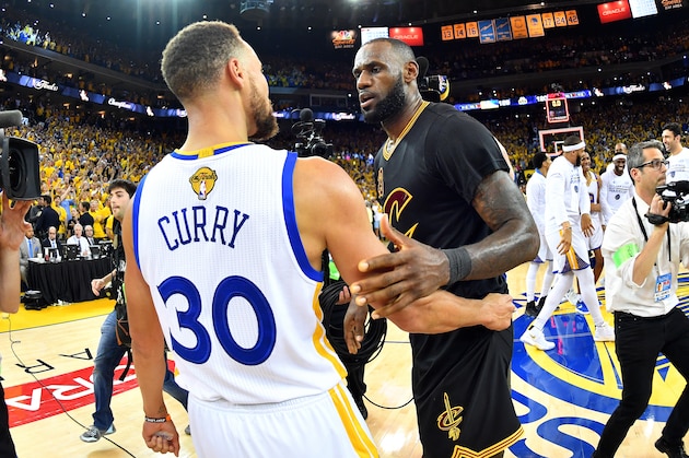OAKLAND, CA - JUNE 12: LeBron James #23 of the Cleveland Cavaliers talks with Stephen Curry #30 of the Golden State Warriors in Game Five of the 2017 NBA Finals on June 12, 2017 at ORACLE Arena in Oakland, California. NOTE TO USER: User expressly acknowledges and agrees that, by downloading and or using this photograph, user is consenting to the terms and conditions of Getty Images License Agreement. Mandatory Copyright Notice: Copyright 2017 NBAE (Photo by Jesse D. Garrabrant/NBAE via Getty Images)