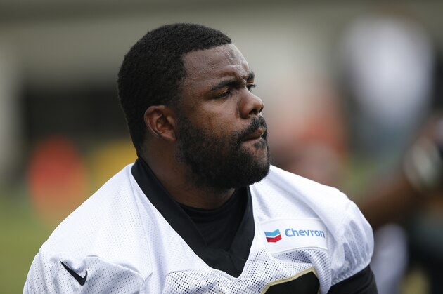 New Orleans Saints running back Mark Ingram stretches during NFL football practice in Metairie, La., Wednesday, June 14, 2017. (AP Photo/Gerald Herbert)