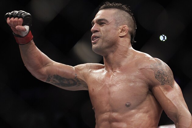 FILE - In this Jan. 20, 2013 file photo, Vitor Belfort, from Brazil, celebrates after defeating Michael Bisping during a middleweight mixed martial arts bout in Sao Paulo, Brazil. Belfort is scheduled to fight Chris Weidman in a middleweight title matchup on Saturday, May 23, 2015 at UFC 187. in Las Vegas,.(AP Photo/Andre Penner, File)