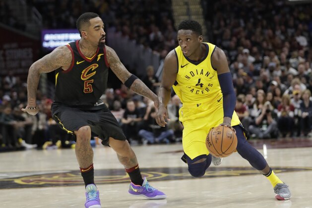 Indiana Pacers' Victor Oladipo (4) drives past Cleveland Cavaliers' JR Smith (5) in the second half of Game 7 of an NBA basketball first-round playoff series, Sunday, April 29, 2018, in Cleveland. (AP Photo/Tony Dejak)