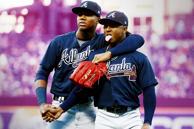 NEW YORK, NY - MAY 01:  (NEW YORK DAILIES OUT)   Ozzie Albies #1 and Ronald Acuna Jr. #13 of the Atlanta Braves prepare for a game against the New York Mets at Citi Field on May 1, 2018 in the Flushing neighborhood of the Queens borough of New York City. The Braves defeated the Mets 3-2.  (Photo by Jim McIsaac/Getty Images)