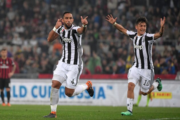 Juventus' defender from Italy Medhi Benatia (L) celebrates with teammate Juventus' forward from Argentina Paulo Dybala after scoring during the Italian Tim Cup (Coppa Italia) final Juventus vs AC Milan at the Olympic stadium on May 9, 2018 in Rome. (Photo by Tiziana FABI / AFP)        (Photo credit should read TIZIANA FABI/AFP/Getty Images)
