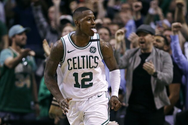 Boston Celtics guard Terry Rozier celebrates after a driving to the basket late in the fourth quarter against the Philadelphia 76ers in Game 5 of an NBA basketball playoff series in Boston, Wednesday, May 9, 2018. Rozier scored 24 points as the Celtics defeated the 76ers 114-112. (AP Photo/Charles Krupa)