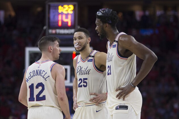 PHILADELPHIA, PA - MAY 7: T.J. McConnell #12 of the Philadelphia 76ers talks to Ben Simmons #25 and Joel Embiid #21 in the fourth quarter against the Boston Celtics during Game Four of the Eastern Conference Second Round of the 2018 NBA Playoffs at Wells Fargo Center on May 7, 2018 in Philadelphia, Pennsylvania. The 76ers defeated the Celtics 103-92. NOTE TO USER: User expressly acknowledges and agrees that, by downloading and or using this photograph, User is consenting to the terms and conditions of the Getty Images License Agreement. (Photo by Mitchell Leff/Getty Images)