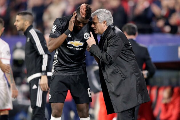 SEVILLA, SPAIN - FEBRUARY 21: (L-R) Paul Pogba of Manchester United, coach Jose Mourinho of Manchester United  during the UEFA Champions League  match between Sevilla v Manchester United at the Estadio Ramon Sanchez Pizjuan on February 21, 2018 in Sevilla Spain (Photo by Jeroen Meuwsen/Soccrates/Getty Images)