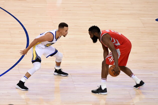 OAKLAND, CA - OCTOBER 17:  James Harden #13 of the Houston Rockets makes a move against Stephen Curry #30 of the Golden State Warriors on October 17, 2017 at ORACLE Arena in Oakland, California. NOTE TO USER: User expressly acknowledges and agrees that, by downloading and or using this photograph, user is consenting to the terms and conditions of Getty Images License Agreement. Mandatory Copyright Notice: Copyright 2017 NBAE (Photo by Adam Pantozzi/NBAE via Getty Images)