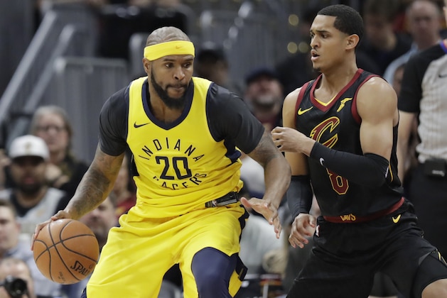 Indiana Pacers' Trevor Booker (20) drives past Cleveland Cavaliers' Jordan Clarkson (8) in the first half of Game 2 of an NBA basketball first-round playoff series, Wednesday, April 18, 2018, in Cleveland. (AP Photo/Tony Dejak)