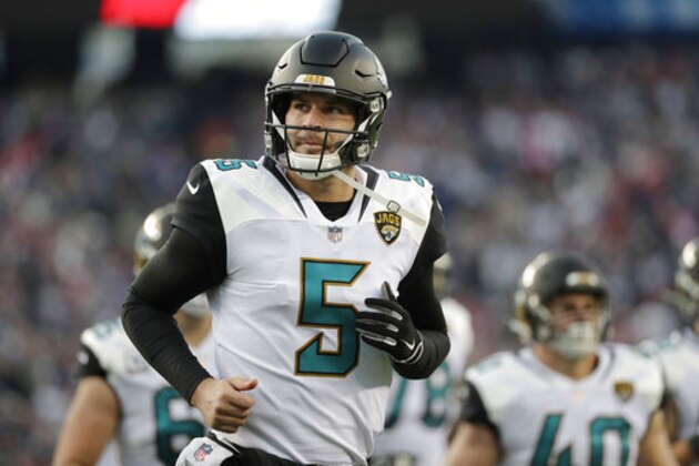 Jacksonville Jaguars quarterback Blake Bortles runs to the locker room after the first half of the AFC championship NFL football game against the New England Patriots, Sunday, Jan. 21, 2018, in Foxborough, Mass. (AP Photo/David J. Phillip)