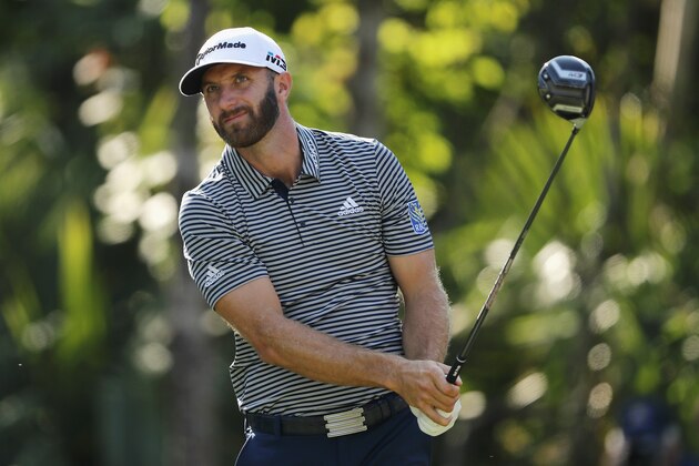 PONTE VEDRA BEACH, FL - MAY 10:  Dustin Johnson of the United States plays his shot from the 15th tee during the first round of THE PLAYERS Championship on the Stadium Course at TPC Sawgrass on May 10, 2018 in Ponte Vedra Beach, Florida.  (Photo by Richard Heathcote/Getty Images)