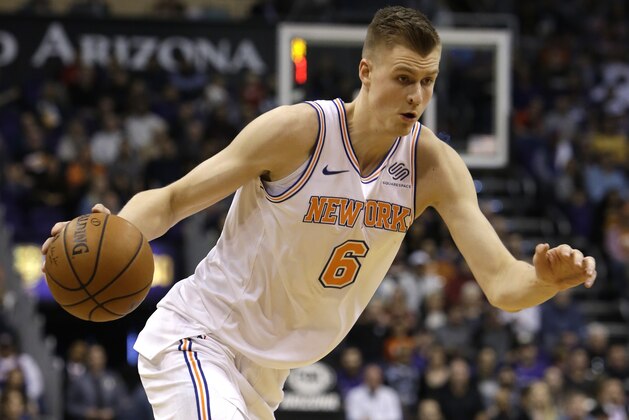 New York Knicks forward Kristaps Porzingis (6) in the first half during an NBA basketball game against the Phoenix Suns, Friday, Jan. 26, 2018, in Phoenix. (AP Photo/Rick Scuteri)