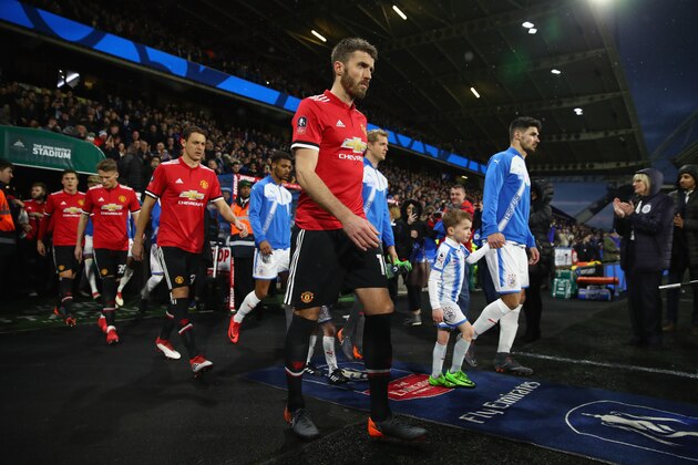 HUDDERSFIELD, ENGLAND - FEBRUARY 17: : Michael Carrick of Manchester United leads his team out on to the pitch during the The Emirates FA Cup Fifth Round between Huddersfield Town v Manchester United  on February 17, 2018 in Huddersfield, United Kingdom.  (Photo by Clive Brunskill/Getty Images)