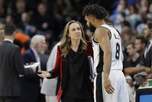 San Antonio Spurs assistant coach Becky Hammon, left, talks with guard Patty Mills (8) during the second half of an NBA basketball game against the New York Nets, Tuesday, Dec. 26, 2017, in San Antonio. San Antonio won 109-97.(AP Photo/Eric Gay)