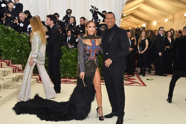 Jennifer Lopez and Alex Rodriguez arrive for the 2018 Met Gala on May 7, 2018, at the Metropolitan Museum of Art in New York. - The Gala raises money for the Metropolitan Museum of Arts Costume Institute. The Gala's 2018 theme is Heavenly Bodies: Fashion and the Catholic Imagination. (Photo by ANGELA WEISS / AFP)        (Photo credit should read ANGELA WEISS/AFP/Getty Images)