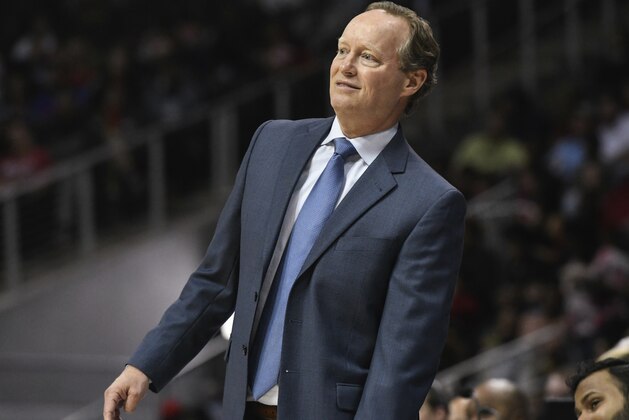 Atlanta Hawks coach Mike Budenholzer watches a three point try during the second half of an NBA basketball game against the Philadelphia 76ers Tuesday, April 10, 2018, in Atlanta. Philadelphia won 121-113. (AP Photo/John Amis)