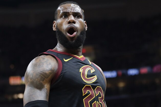 Cleveland Cavaliers' LeBron James (23) reacts after dunking against the Toronto Raptors in the first half of Game 3 of an NBA basketball second-round playoff series, Saturday, May 5, 2018, in Cleveland. (AP Photo/Tony Dejak)