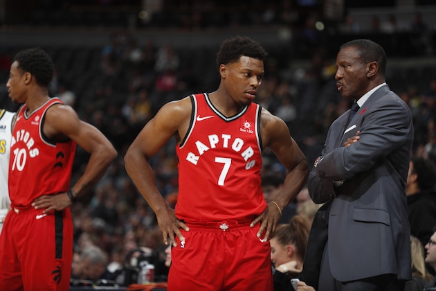 Toronto Raptors guard Kyle Lowry (7) chats with Toronto Raptors head coach Dwane Casey in the first half of an NBA basketball game Wednesday, Nov. 1, 2017, in Denver. (AP Photo/David Zalubowski)