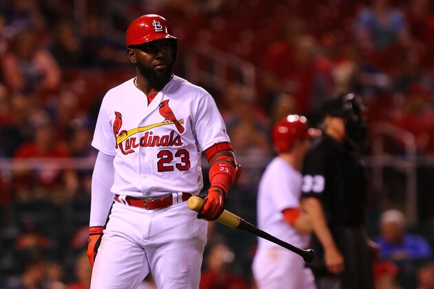 ST. LOUIS, MO - MAY 7:  Marcell Ozuna #23 of the St. Louis Cardinals returns to the dugout after striking out against the Minnesota Twins in the ninth inning at Busch Stadium on May 7, 2018 in St. Louis, Missouri.  (Photo by Dilip Vishwanat/Getty Images)