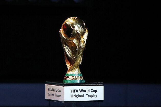 FILE - A Friday Dec. 1, 2017 file photo of the World Cup trophy placed on display during the 2018 soccer World Cup draw in the Kremlin in Moscow. Morocco has touted its limited threat from gun crime in a 2026 World Cup bidding proposal to take on the United States-led rival for the 2026 soccer showpiece. The North African nation highlights safety for visiting fans in bidding documents published by FIFA on Monday that do however show every stadium and training ground requires building work. (AP Photo/Pavel Golovkin, File)