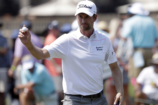 Webb Simpson shows his ball after making a birdie putt on the ninth hole during the second round of The Players Championship golf tournament Friday, May 11, 2018, in Ponte Vedra Beach, Fla. (AP Photo/John Raoux)
