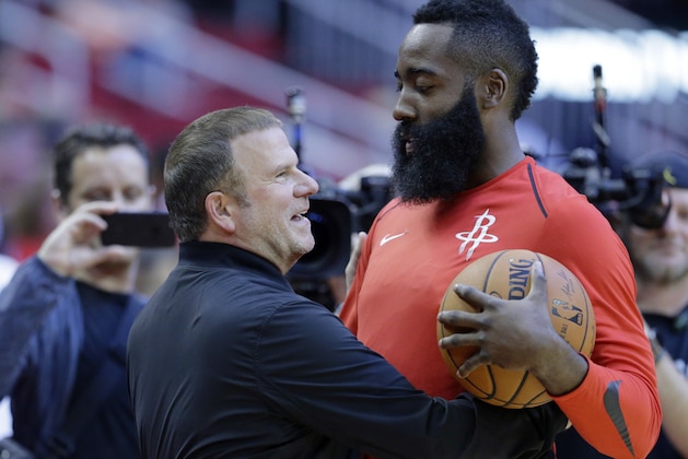 The new owner of the Houston Rockets Tilman Fertitta and player James Harden before their game against the San Antonio Spurs in an NBA pre season basketball game Friday, Oct. 13, 2017, in Houston. (AP Photo/Michael Wyke)