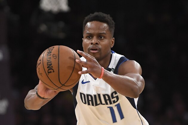 Dallas Mavericks guard Yogi Ferrell passes during the first half of an NBA basketball game against the Los Angeles Lakers, Friday, Feb. 23, 2018, in Los Angeles. (AP Photo/Mark J. Terrill)