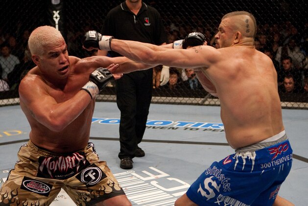LAS VEGAS - DECEMBER 30:  (L-R) Tito Ortiz and Chuck Liddell exchange punches at  UFC 66 at the MGM Grand Garden Arena on December 30, 2006 in Las Vegas, Nevada.  (Photo by Josh Hedges/Zuffa LLC/Zuffa LLC via Getty Images)