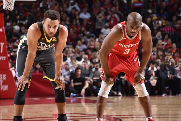 HOUSTON, TX - JANUARY 20: Stephen Curry #30 of the Golden State Warriors and Chris Paul #3 of the Houston Rockets looks on during the game on January 20, 2018 at the Toyota Center in Houston, Texas. NOTE TO USER: User expressly acknowledges and agrees that, by downloading and or using this photograph, User is consenting to the terms and conditions of the Getty Images License Agreement. Mandatory Copyright Notice: Copyright 2018 NBAE (Photo by Bill Baptist/NBAE via Getty Images)