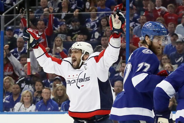 TAMPA, FL - MAY 11: Alex Ovechkin #8 of the Washington Capitals celebrates a first period goal by Michal Kempny #6 against the Tampa Bay Lightning in Game One of the Eastern Conference Finals during the 2018 NHL Stanley Cup Playoffs at the Amalie Arena on May 11, 2018 in Tampa, Florida. The Capitals defeated the Lightning 4-2. (Photo by Bruce Bennett/Getty Images)