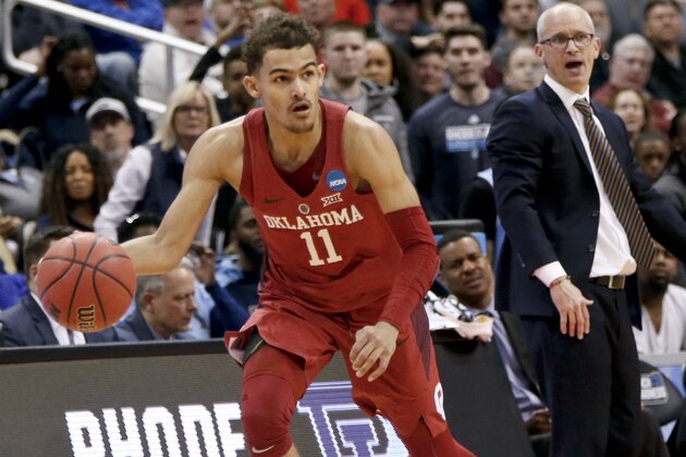 Oklahoma's Trae Young brings the ball up court during overtime of an NCAA men's college basketball tournament first-round game against Rhode Island, Thursday, March 15, 2018, in Pittsburgh. (AP Photo/Keith Srakocic)