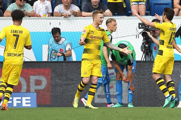 Dortmund's German forward Marco Reus celebrates scoring the 1-1 during the German first division Bundesliga football match TSG 1899 Hoffenheim vs Borussia Dortmund in Sinsheim, southern Germany, on May 12, 2018. (Photo by Amelie QUERFURTH / AFP) / RESTRICTIONS: DURING MATCH TIME: DFL RULES TO LIMIT THE ONLINE USAGE TO 15 PICTURES PER MATCH AND FORBID IMAGE SEQUENCES TO SIMULATE VIDEO. == RESTRICTED TO EDITORIAL USE == FOR FURTHER QUERIES PLEASE CONTACT DFL DIRECTLY AT + 49 69 650050        (Photo credit should read AMELIE QUERFURTH/AFP/Getty Images)