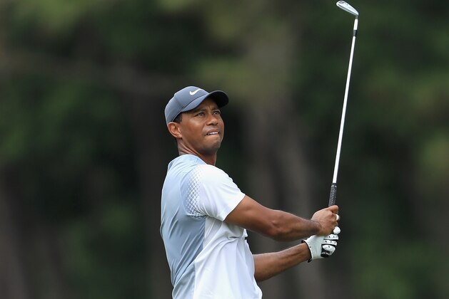 PONTE VEDRA BEACH, FL - MAY 12:  Tiger Woods of the United States plays a shot on the tenth hole during the third round of THE PLAYERS Championship on the Stadium Course at TPC Sawgrass on May 12, 2018 in Ponte Vedra Beach, Florida.  (Photo by Sam Greenwood/Getty Images)