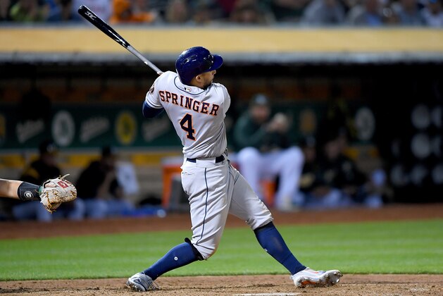 OAKLAND, CA - MAY 08:  George Springer #4 of the Houston Astros hits a two-run rbi double against the Oakland Athletics in the top of the fifth inning at the Oakland Alameda Coliseum on May 8, 2018 in Oakland, California.  (Photo by Thearon W. Henderson/Getty Images)