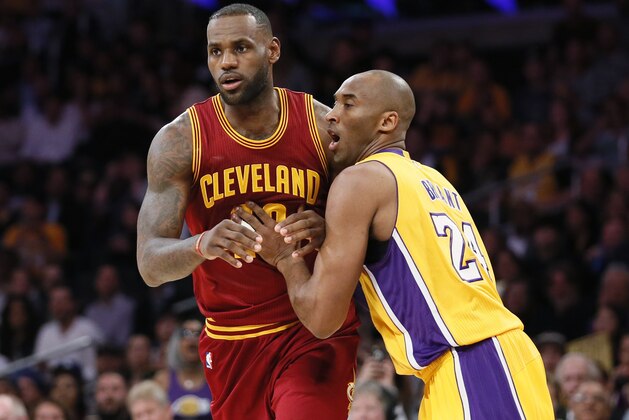Cleveland Cavaliers' LeBron James, left, moves into position while Los Angeles Lakers' Kobe Bryant, right, defends during the first half of an NBA basketball game Thursday, March 10, 2016, in Los Angeles. (AP Photo/Danny Moloshok)