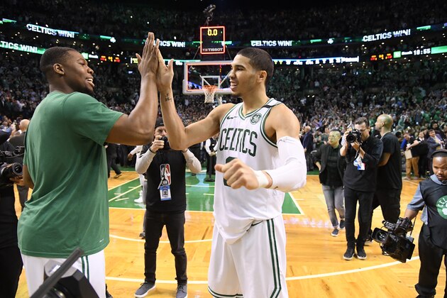 BOSTON, MA - MAY 9:  Jayson Tatum #0 and Guerschon Yabusele #30 of the Boston Celtics high five after the game against the Philadelphia 76ers in Game Five of the Eastern Conference Semifinals of the 2018 NBA Playoffs on May 9, 2018 at TD Garden in Boston, Massachusetts. NOTE TO USER: User expressly acknowledges and agrees that, by downloading and or using this Photograph, user is consenting to the terms and conditions of the Getty Images License Agreement. Mandatory Copyright Notice: Copyright 2018 NBAE (Photo by Brian Babineau/NBAE via Getty Images)