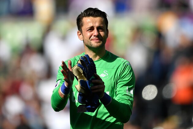 SWANSEA, WALES - MAY 13:  Lukasz Fabianski of Swansea City cries as he leaves the pitch during the Premier League match between Swansea City and Stoke City at Liberty Stadium on May 13, 2018 in Swansea, Wales.  (Photo by Dan Mullan/Getty Images)