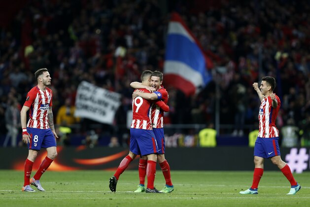 Atletico players celebrate at the end of the Europa League semifinal, second leg soccer match between Atletico Madrid and Arsenal at the Metropolitano stadium in Madrid, Spain, Thursday, May 3, 2018. (AP Photo/Francisco Seco)