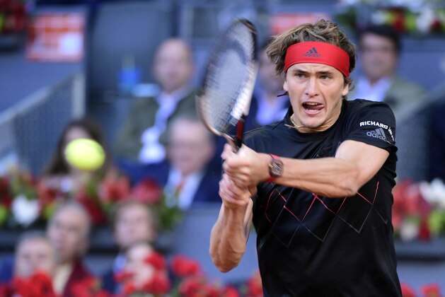 Germany's Alexander Zverev returns the ball to Austria's Dominic Thiem  during their ATP Madrid Open final tennis match at the Caja Magica in Madrid on May 13, 2018. (Photo by JAVIER SORIANO / AFP)        (Photo credit should read JAVIER SORIANO/AFP/Getty Images)