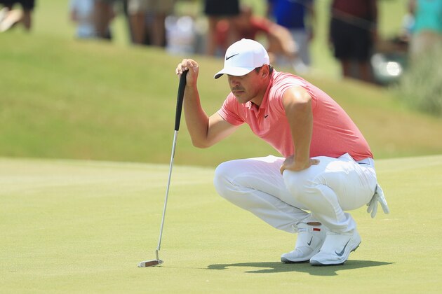 PONTE VEDRA BEACH, FL - MAY 11:  Brooks Koepka of the United States lines up a putt on the second green during the second round of THE PLAYERS Championship on the Stadium Course at TPC Sawgrass on May 11, 2018 in Ponte Vedra Beach, Florida.  (Photo by Mike Ehrmann/Getty Images)