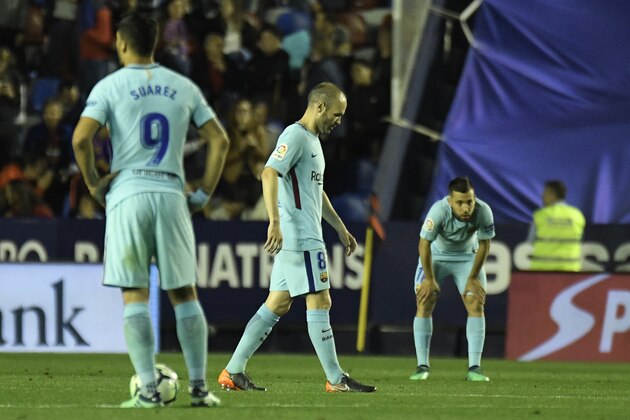 Barcelona's Spanish midfielder Andres Iniesta (C) walks on the pitch after a Levante goal during the Spanish league football match between Levante and Barcelona at the Ciutat de Valencia stadium in Valencia on May 13, 2018. (Photo by JOSE JORDAN / AFP)        (Photo credit should read JOSE JORDAN/AFP/Getty Images)
