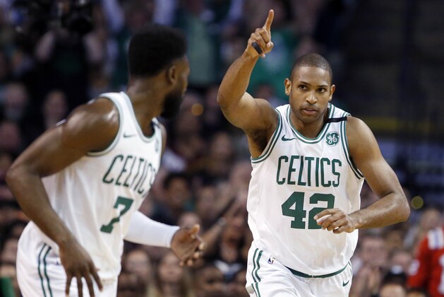 Boston Celtics forward Al Horford (42) celebrates a made basket with guard Jaylen Brown (7) during the first quarter of Game 1 of the NBA basketball Eastern Conference Finals against the Cleveland Cavaliers, Sunday, May 13, 2018, in Boston. (AP Photo/Michael Dwyer)