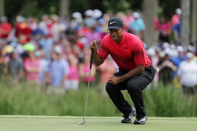 PONTE VEDRA BEACH, FL - MAY 13:  Tiger Woods of the United States lines up a putt during the final round of THE PLAYERS Championship on the Stadium Course at TPC Sawgrass on May 13, 2018 in Ponte Vedra Beach, Florida.  (Photo by Richard Heathcote/Getty Images)
