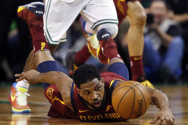 Cleveland Cavaliers center Tristan Thompson dives for the ball during the first half of Game 1 of the NBA basketball Eastern Conference Finals against the Boston Celtics, Sunday, May 13, 2018, in Boston. (AP Photo/Michael Dwyer)