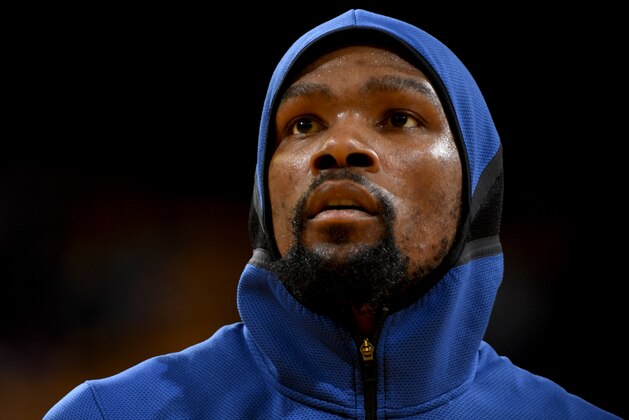 OAKLAND, CA - MAY 8:  Kevin Durant #35 of the Golden State Warriors looks on during the game against the New Orleans Pelicans in Game Five of the Western Conference Semifinals of the 2018 NBA Playoffs on May 8, 2018 at Oracle Arena in Oakland, California. NOTE TO USER: User expressly acknowledges and agrees that, by downloading and or using this photograph, user is consenting to the terms and conditions of Getty Images License Agreement. Mandatory Copyright Notice: Copyright 2018 NBAE (Photo by Garrett Ellwood/NBAE via Getty Images)