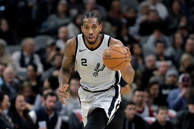 FILE - In this Jan. 13, 2018, file photo, San Antonio Spurs forward Kawhi Leonard (2) moves the ball up court during the second half of an NBA basketball game against the Denver Nuggets, in San Antonio. The absolute unwillingness to answer certain questions is part of the San Antonio Spurs' mystique. The Spurs just don't share much. So there is some unmistakable irony here that when it comes to the obviously fractured relationship between San Antonio and Kawhi Leonard, it's the Spurs who are the ones frustrated by the lack of answers. (AP Photo/Eric Gay, File)