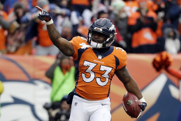 Denver Broncos running back De'Angelo Henderson (33) celebrates after a touchdown reception against the Kansas City Chiefs during the first half of an NFL football game Sunday, Dec. 31, 2017, in Denver. (AP Photo/Jack Dempsey)